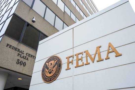 Election workers and cybersecurity infrastructure illustrating FEMA election security funding requirements and election administration.