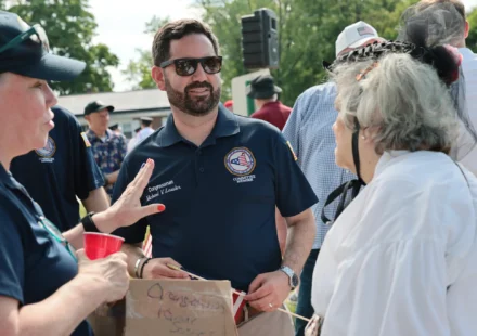 Rep. Mike Lawler campaigning in New York's 17th Congressional District during the 2026 election while highlighting campaign fundraising efforts.