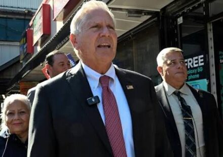 Bruce Blakeman speaks at a podium as New York Democrats seek an investigation into his campaign finance reports.